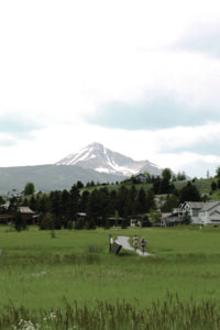 Lone Mountain serves as backdrop for Big Sky bike riders along the Crail Ranch Trail. PHOTO BY TYLER BUSBY