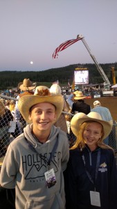 Grayson and Finley enjoying the fifth annual Big Sky PBR as the Blue Moon rises over the eastern horizon.