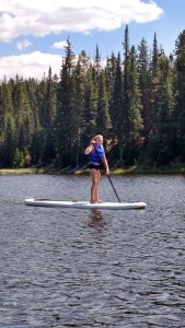Finley paddleboarding on Big Sky Resort's Lake Levinsky