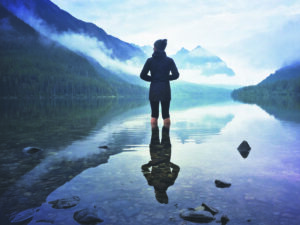 Julie Hotz’s hiking partner Grace Nichols, soaking in the morning on Upper Kintla Lake.