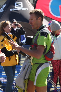 Franco Colle, winner of The Rut 50K, talks to reporters at the finish line on Aug. 6.