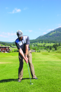 The specialist demonstrates proper body and ball position when approaching uphill lie. PHOTOS BY TYLER ALLEN