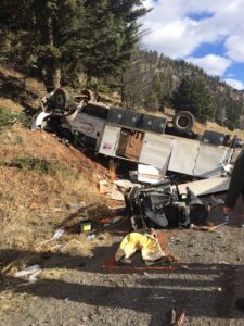 A three-vehicle collision on MT 64 in August resulted in no fatalities but totaled two passenger vehicles and left this electrical truck overturned in the westbound ditch. OUTLAW PARTNERS PHOTO