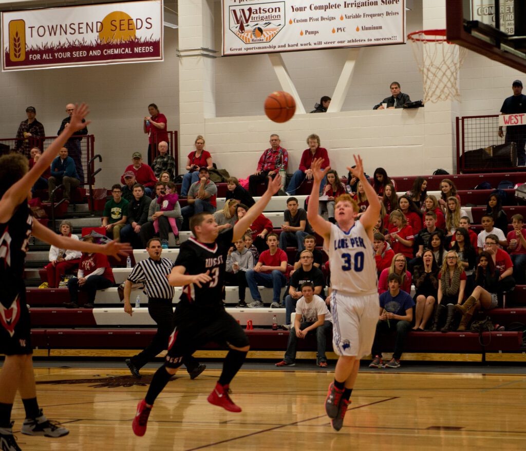 Jackson Wade scored nine points against the Wolverines for entrance to the 11/12C District tournament. Chris Tompkins scored 10 and Eddie Starz earned a game-high 23 points in the contest. Photo by Jill Bough