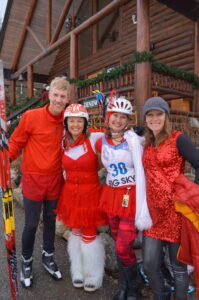 L to R: Sam Ried, Denise Simmons, Traci Sessions, Sarah Gaither pose at the finish of the Mad Wolf Winter Relay Race PHOTO BY SAM JOHNSON