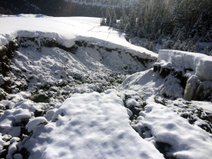 The washed out area just below the breeched sleeve at the Yellowstone Club wastewater retention pond, causing the high erosion rates into Second Yellow Mule Creek. PHOTO COURTESY OF BIG SKY WATER AND SEWER DISTRICT