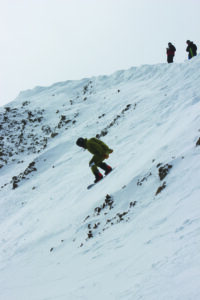 Josh Katz attempting to reach orbit during his second-place run in the men’s snowboard division.