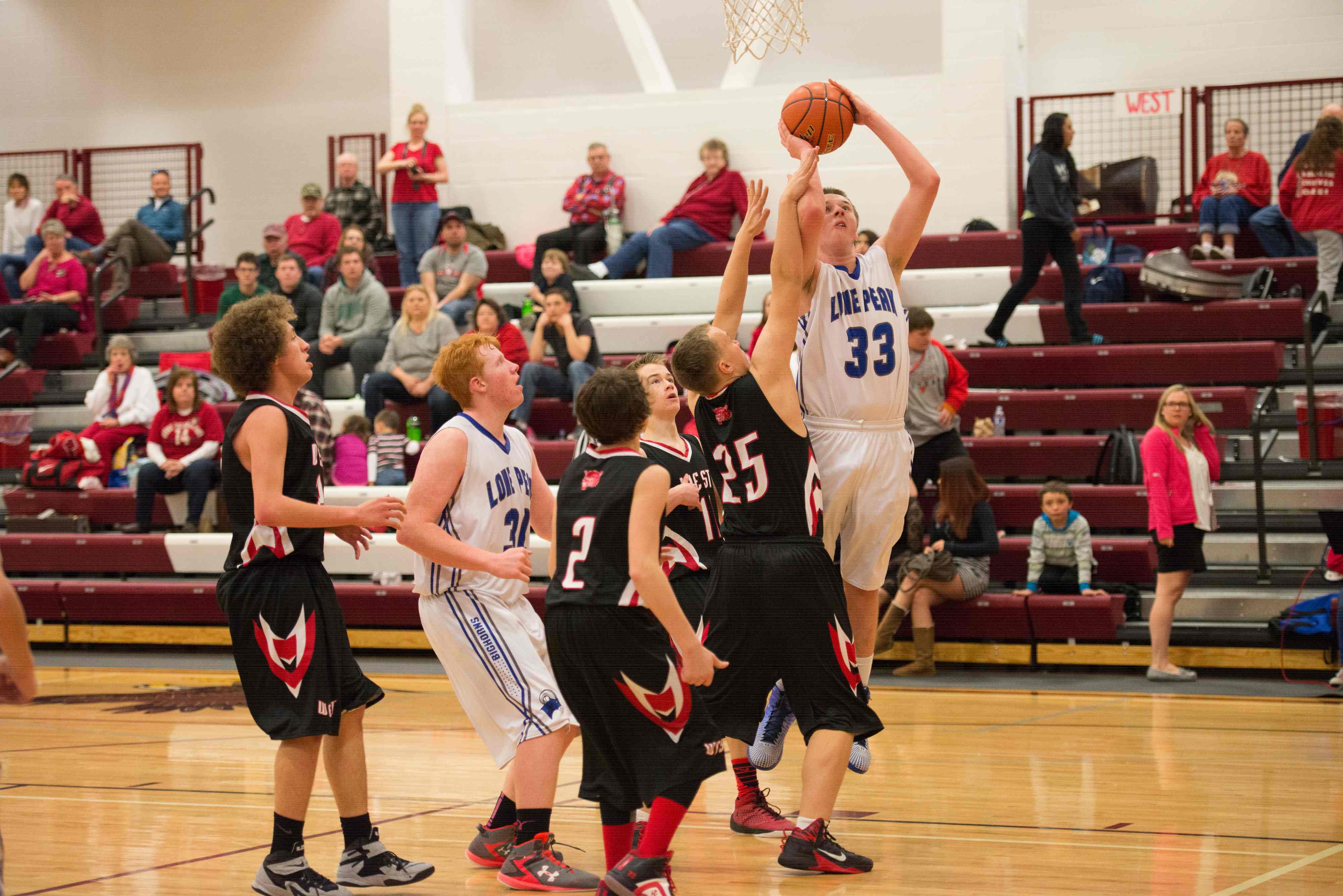 Senior post Chris Thompkins shoots through a foul against West Yellowstone. "He had a heck of a senior year," said LPHS head coach Al Malinowski, adding that he finished the season with 149 points. PHOTO BY TORI PINTAR