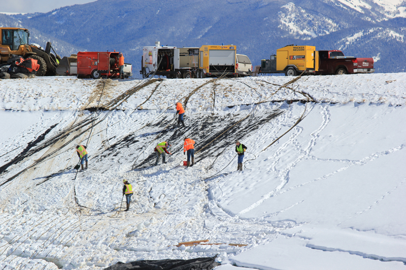 A response team enters the emptied wastewater pond March 7. PHOTOS COURTESY OF BIG SKY WATER AND SEWER DISTRICT