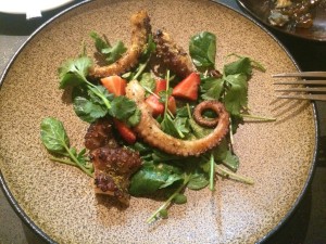 Served on a bed of watercress, strawberries, cilantro, and dusted with crispy yeast, the octopus is chewy yet light, with a hint of charred sweetness.