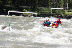 Competitors attempt to paddle through a gate during the festival’s 2015 Community Raft Slalom.