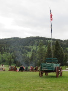 Guests enjoy their meal around a fire pit during 320’s Monday Night Pig Roast.