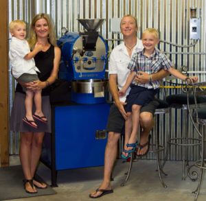 From left: Ollie, Kelly, Bryan and Max pose with their Diedrich Roaster at Blue Bean Coffee Roastery in Paradise Valley. The Deidrich’s roasting technology enables complete control over the roasting environment, allowing Blue Bean to fine tune the flavor in their coffee. 