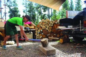 Ronczkowski chops wood to keep the pizza oven hot during service hours. 