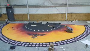 Lee paints the teepee canvas in her Grand Forks, North Dakota, studio.