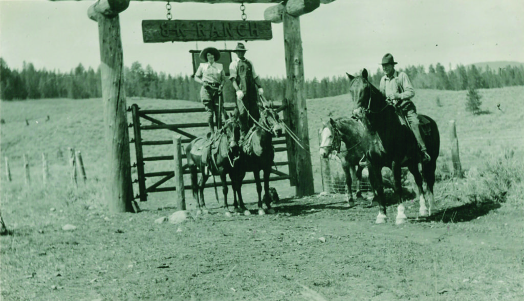Trick riding was popular in the early 1900s, introduced by Russian Cossack immigrants. Several friends show off their balance outside the gates of the B Bar K, which is now called Lone Mountain Ranch.