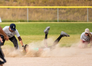 Mouth full of clay. Caleb Helsley slides headfirst into second base.