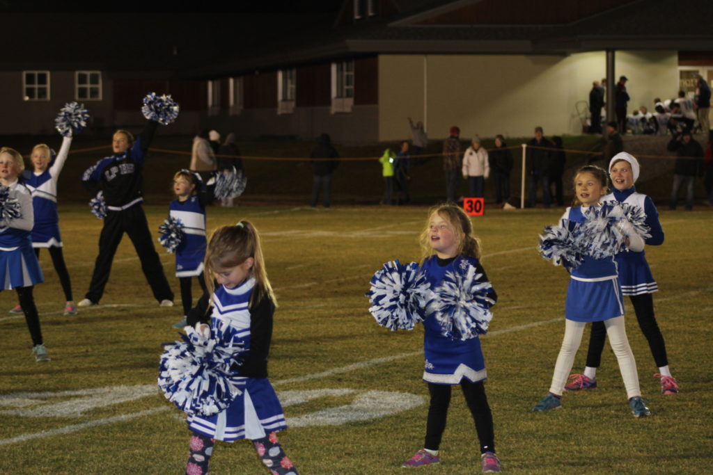 Ophir and Lone Peak cheerleaders rev up the crowd during the Big Horns’ homecoming football game. PHOTO BY BELLA BUTLER