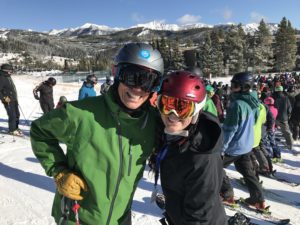 Big Sky Resort General Manager Taylor Middleton and his daughter Kate soak up rays on opening day, Thanksgiving 2016. PHOTO BY TYLER ALLEN