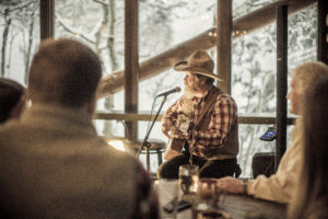 Cowboy singer-songwriter’ and Montana native Bruce Anfinson has been entertaining patrons of Lone Mountain Ranch for a quarter of a century and is a musical fixture in the saloon and at the ranch’s sleigh-ride dinners. PHOTO BY KENE SPERRY
