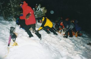 SAR members participate in regular trainings, which include mock missions such as the avalanche victim recovery training pictured here.