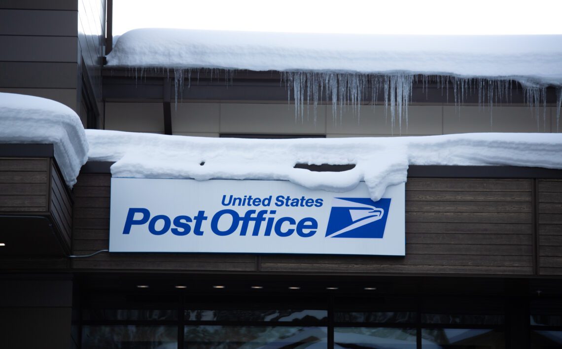 A small staff among hundreds of packages