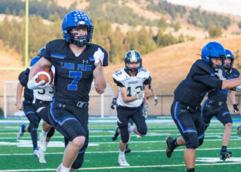 George Helms returns a kickoff for a touchdown in a 2022 Lone Peak High School game in Big Sky. PHOTO BY JASON BACAJ