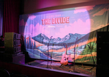 The Live from the Divide banner on the Empire Twin Theatre stage. PHOTO BY CARLI JOHNSON