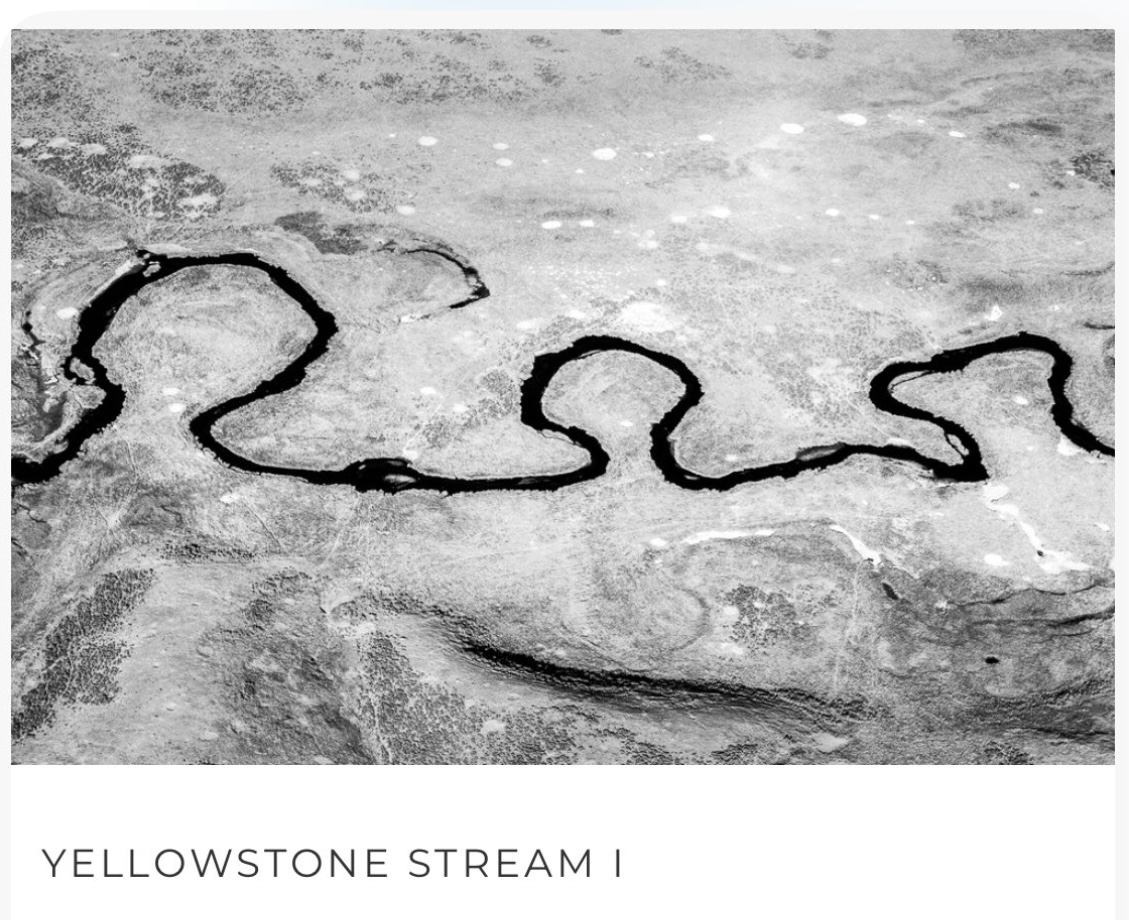 Black-and-white photo of a winding river cutting through rocky terrain; captioned Yellowstone Stream I